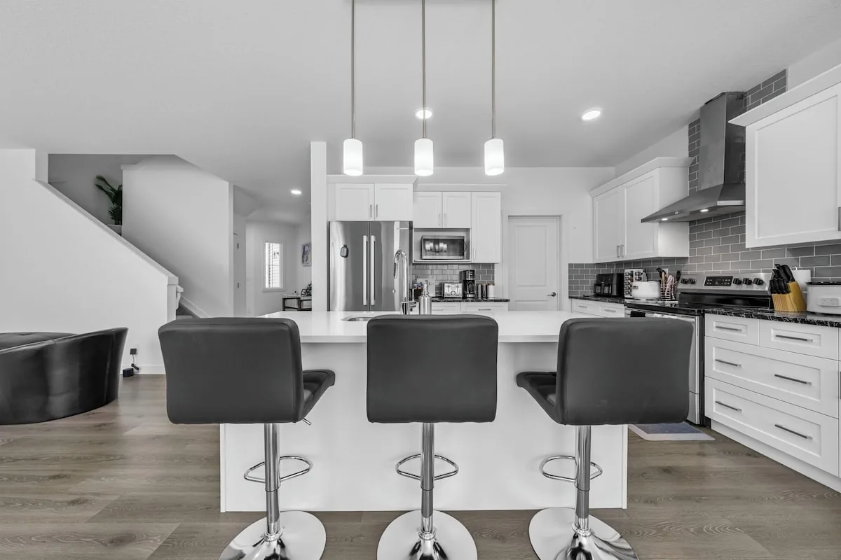 Edgemont furnished main-floor home — kitchen with island and breakfast bar