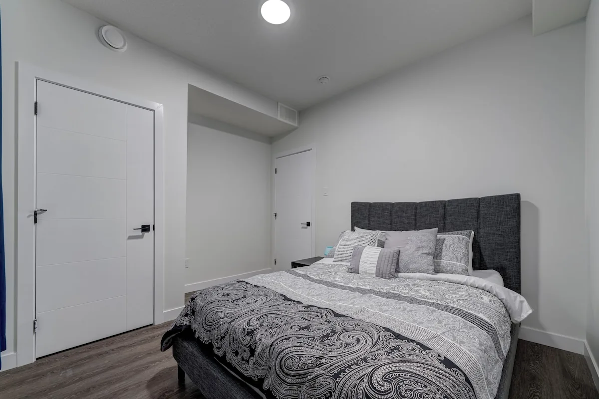 Second bedroom with upholstered bed