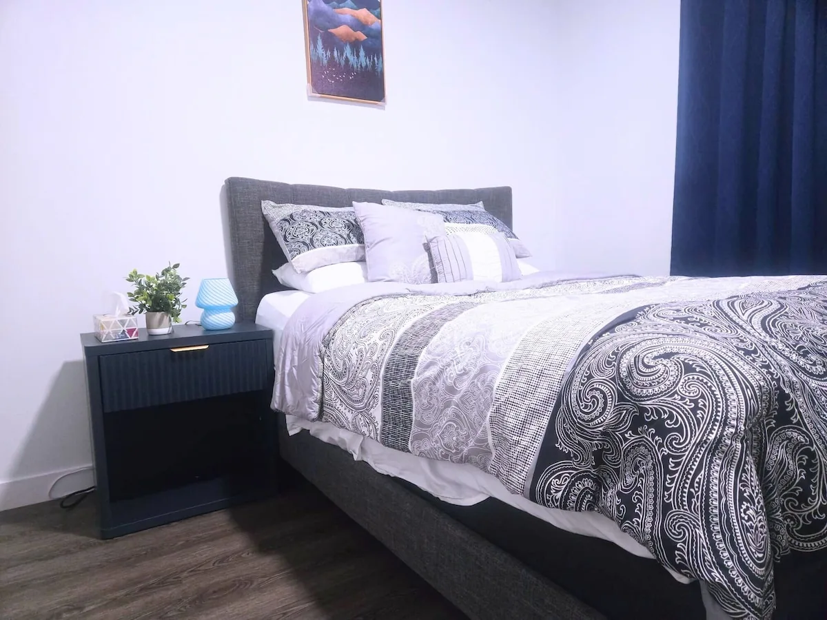 Bedroom with bedside table and reading lamp